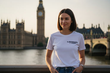 Model in London women’s cotton crewneck t-shirt by Corral Running, angled front view